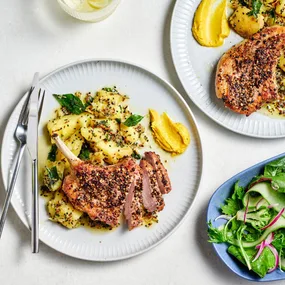 Pepper-crusted pork with crushed potatoes and fragrant spiced oil