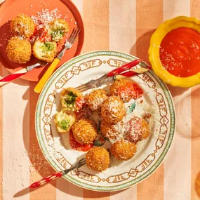 Arancini with basil pesto and smoked scamorza