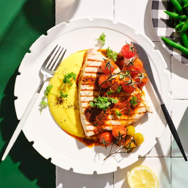 Charred swordfish with ’nduja butter and corn purée