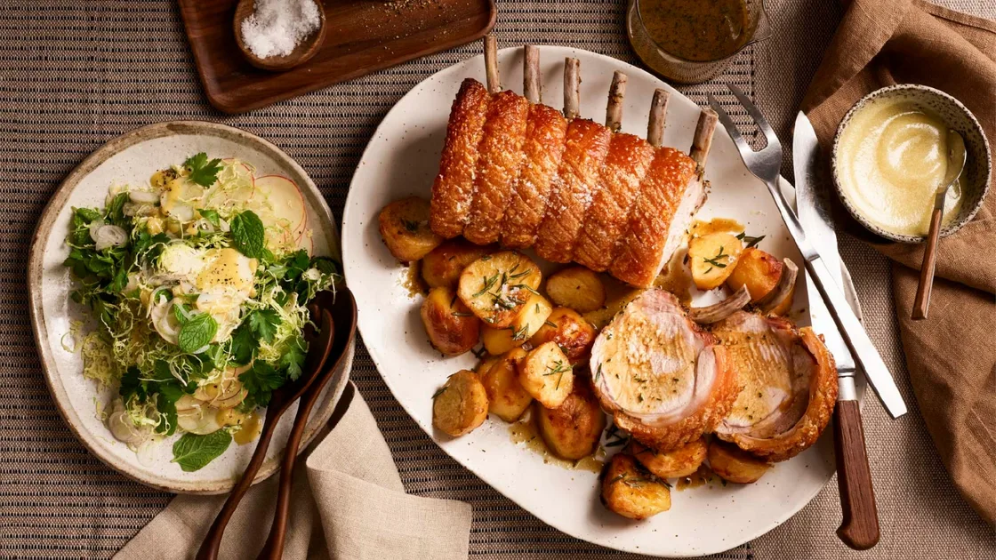 Roast pork rack with spiced apple sauce and apple-Brussels sprout salad