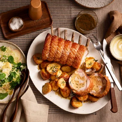 Roast pork rack with spiced apple sauce and apple-Brussels sprout salad