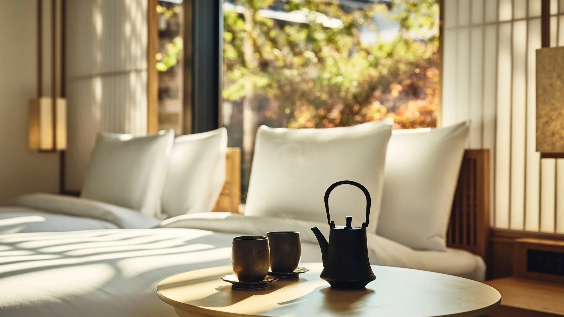 Clean, minimalist rooms surrounded by leafy hills abound at Banyan Tree Higahiyama in Kyoto, Japan