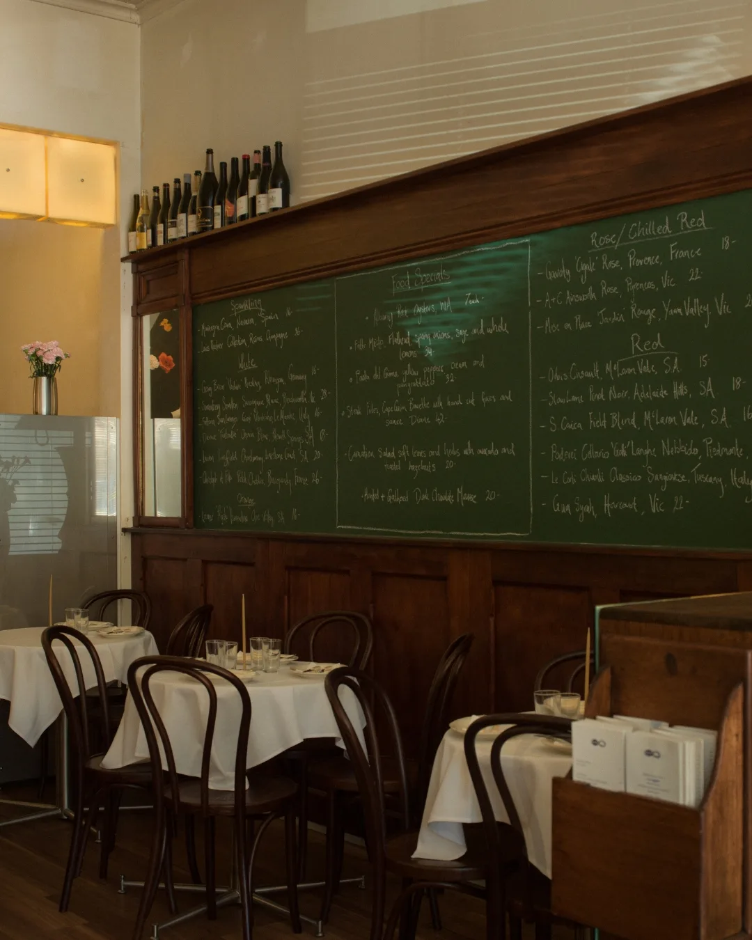 The dining room at Bar Carnation shares the same rustic DNA as Carnation Canteen.