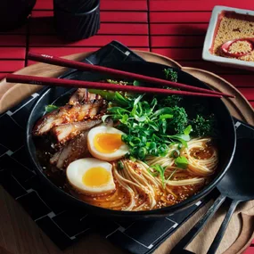 Tonkotsu-style ramen with red braised pork belly and fragrant chilli rayu