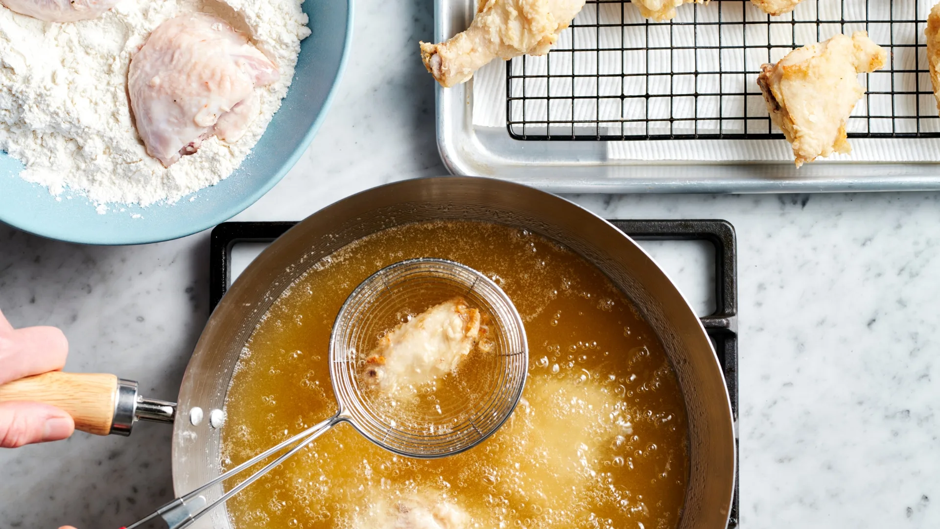 Deep-frying comprises step 4 of making Moon Mart's korean fried chicken