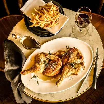 France-Soir’s roast halved chicken with jus and potato frites