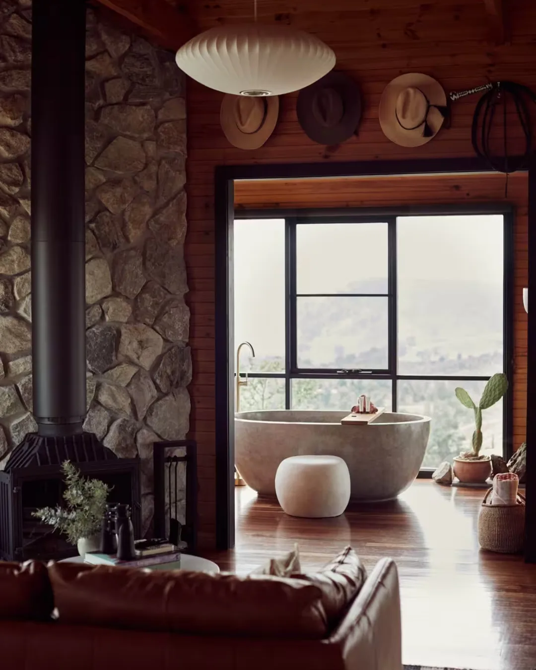Freestanding stone bath and Indoor wood burning fireplace