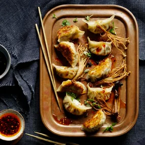 Mushroom gyoza with frizzled enoki mushrooms