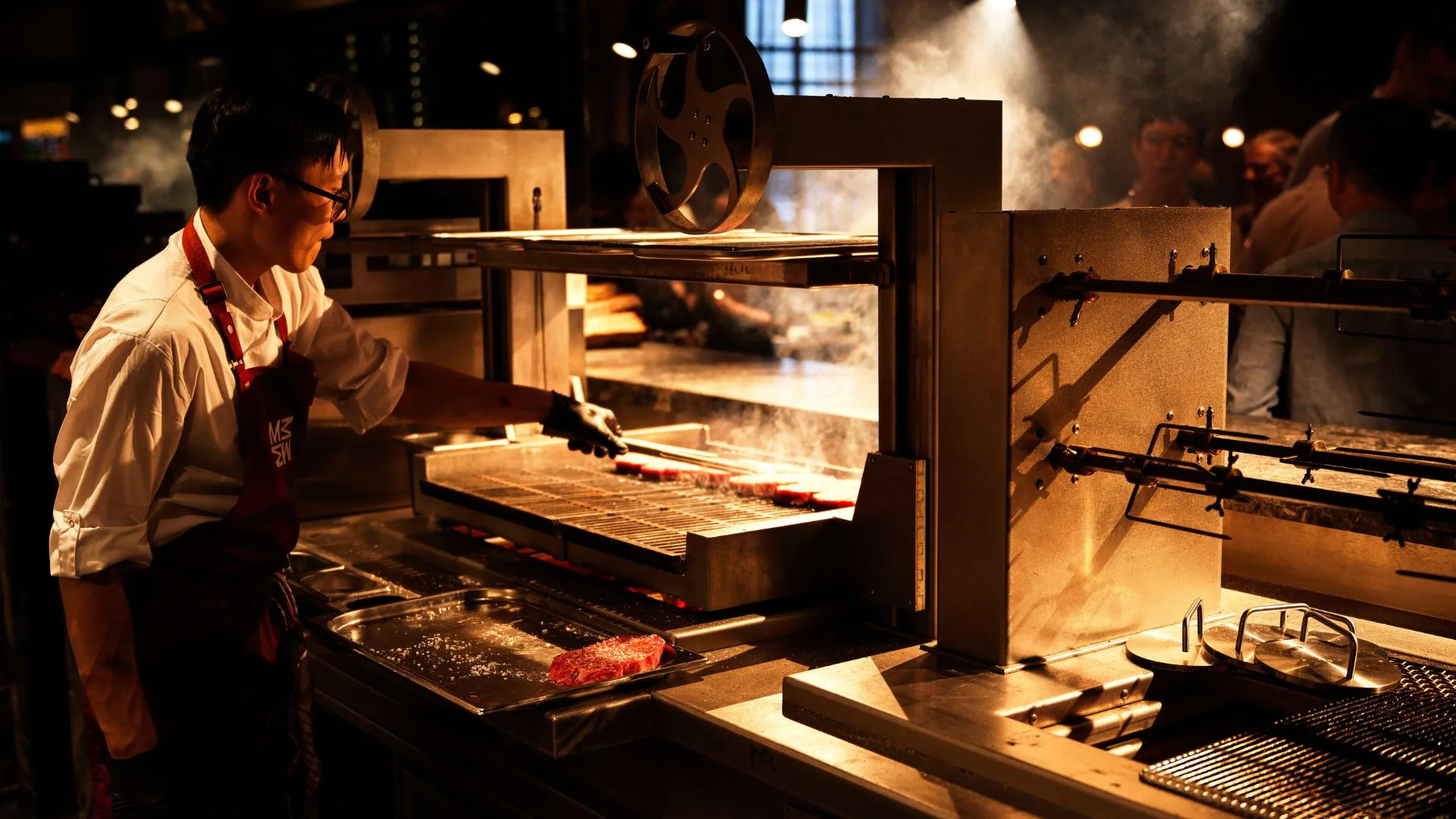 Magma chef grilling on open charcoal fire grill