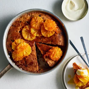 Almond and chocolate skillet cake with roast oranges and creme fraiche