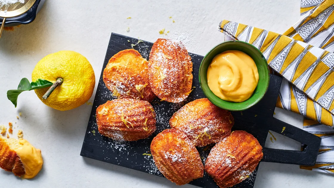 Warm madeleines with yuzu curd recipe - Gourmet Traveller
