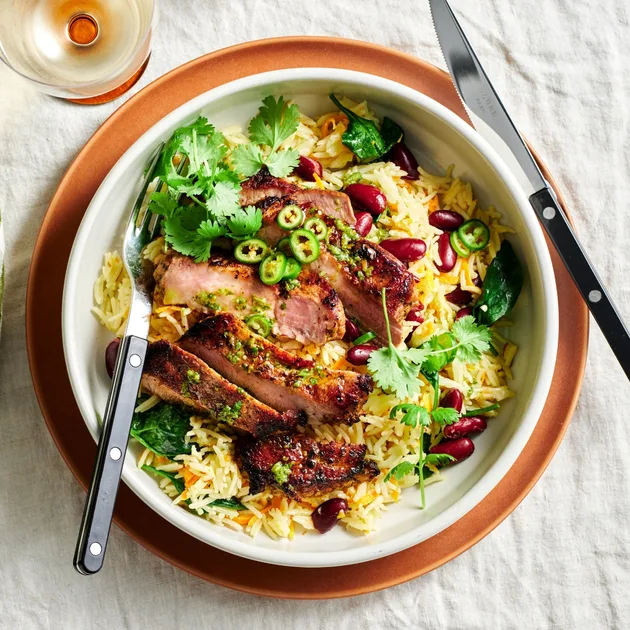 Mojo pork sirloin with coconut and carrot rice recipe - Gourmet Traveller
