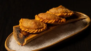 The fried oxtail dumplings at new Sydney restaurant Ashe, resting on a marrow bone