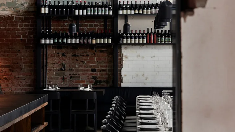 Agnes in Fortitude Valley's dining room with wine-lined shelves