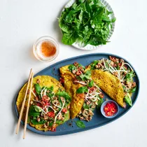 Báhn xèo with pork larb and herbs