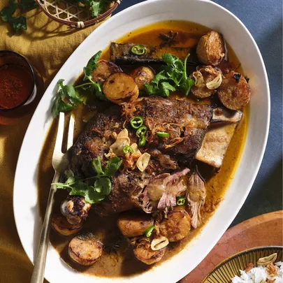 Massaman slow-roasted lamb shoulder with potatoes and green chilli
