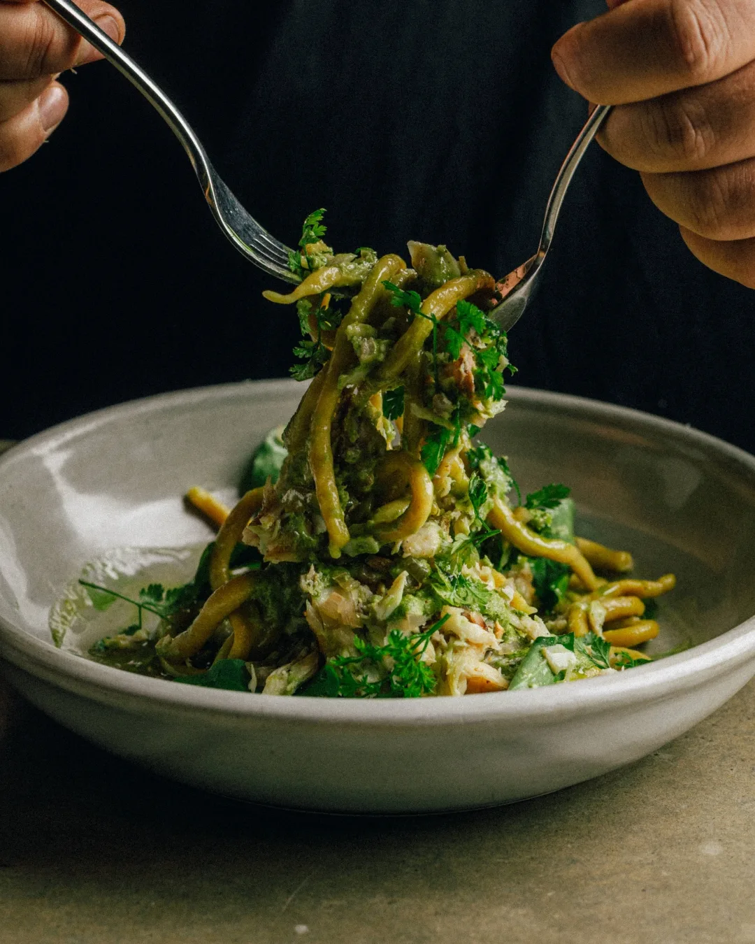 Saadi's sundarkala wheat noodles with spit-roasted wild barramundi, green garlic oil and sesame chutney.