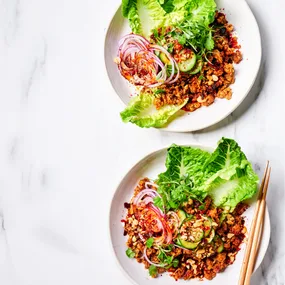 Spicy tempeh larb served with quick pickles