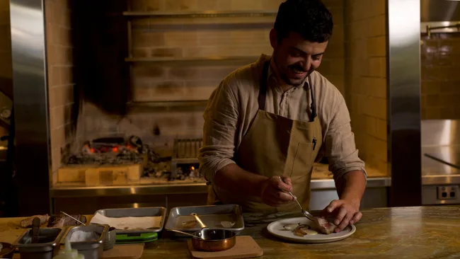 The Woodshed in Kin Kin's chef Oscar Holgado in his element preparing a dish.