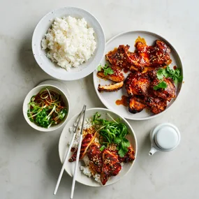 Bulgogi chicken with Korean spring onion salad and a bowl of rice
