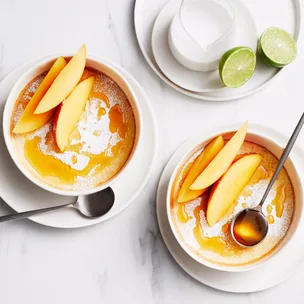 Coconut sponge puddings with mango and amaretto syrup