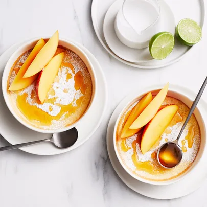 Coconut sponge puddings with mango and amaretto syrup
