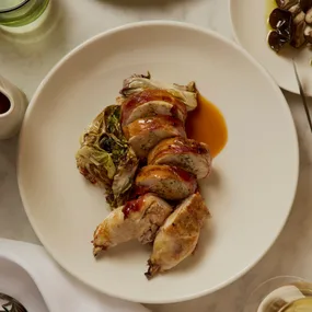 Bistro Livi’s stuffed spatchcock wrapped in pancetta with shiitake mushroom filling