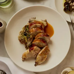 Bistro Livi’s stuffed spatchcock wrapped in pancetta with shiitake mushroom filling