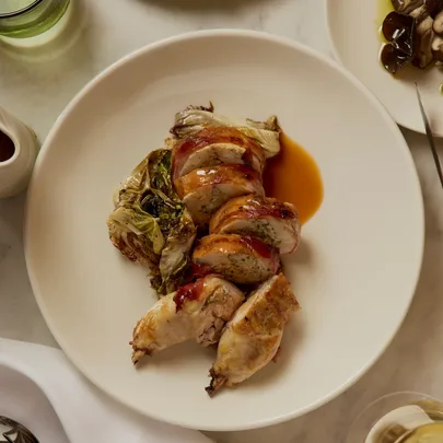 Bistro Livi’s stuffed spatchcock wrapped in pancetta with shiitake mushroom filling
