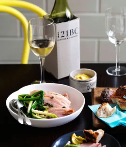 Braised speck with baby leeks