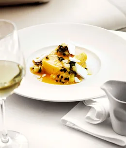 Mango and yoghurt parfait with passionfruit and pineapple salad