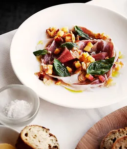 Shaved prosciutto with peach and almond salsa