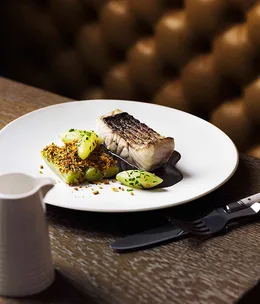 Grilled and poached wild barramundi with red wine sauce