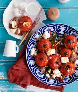 Roast tomatoes with raisins and feta