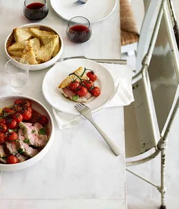 Slow-cooked lamb in Soave with roast cherry tomatoes and semolina gnocchi