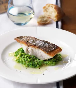 Roasted hapuku with crushed peas and garlic