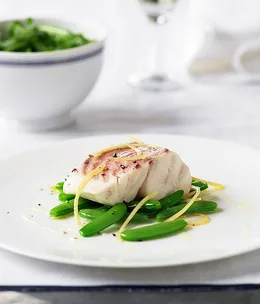 Steamed bass grouper with sugar snap peas and lemon