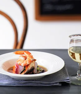 Raw fish, pickled cucumber and wakame salad