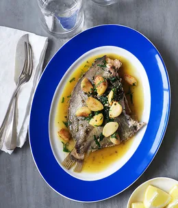 Roast whole dory with caramelised garlic and crushed black pepper