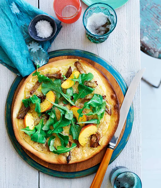 Pork pizza with provolone and peach and rocket salad