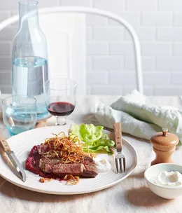 Char-grilled Scotch fillet with beetroot purée, horseradish cream and crisp fried onions