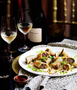 Aromatic lamb spring rolls with labne and toasted grains
