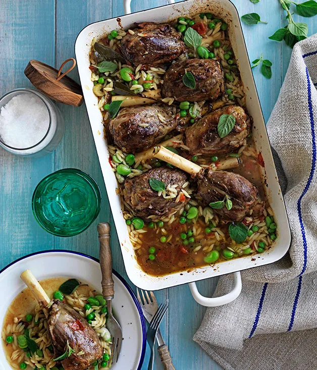 Oregano-braised lamb shanks with broad beans, peas and orzo