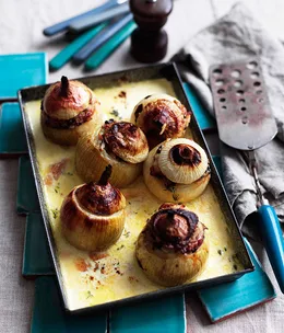 Whole roasted stuffed onions with cream, parmesan and mushrooms