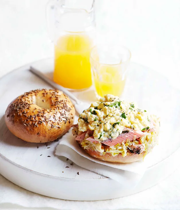 Caraway seed bagels with hot-smoked trout, buttered leeks and scrambled eggs