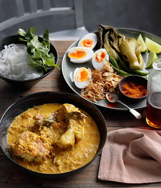Burmese-style fish curry with noodles, mustard greens and duck eggs