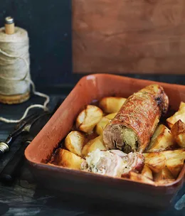 Rolled breast of lamb stuffed with onion and oregano