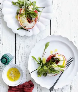 Lobster halves with lemon butter and dandelion leaf salad