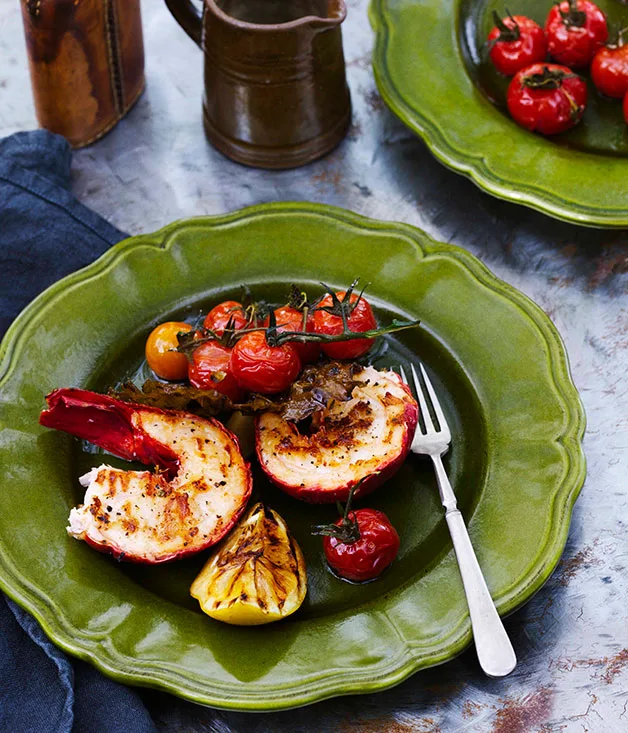 Grilled lobster and vine leaves with confit garlic and tomato