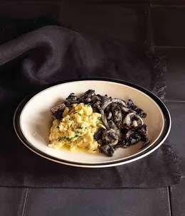 Scrambled eggs with squid in ink